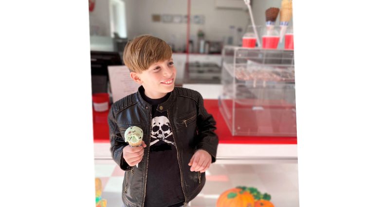 Little boy holding ice cream cone