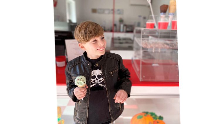 Little boy holding ice cream cone