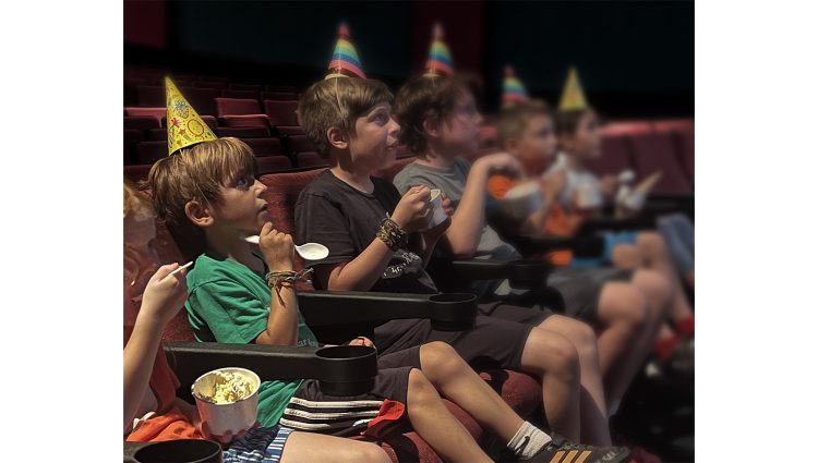 Group of children watching a movie